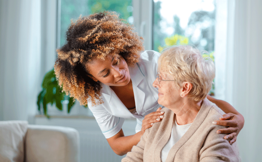 Miracle Care Agency's Senior Care Service - Caregiver with Elderly womam with her arms around her comforting