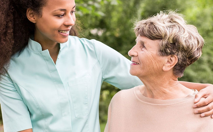 Miracle Group's assisted living photo - nurse hugging and elderly woman